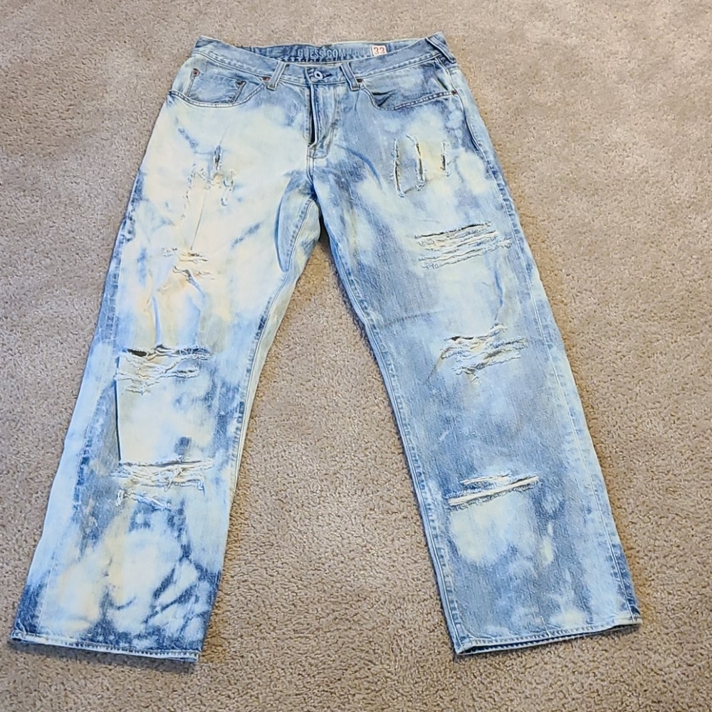 GUESS bleached and distressed jeans.
